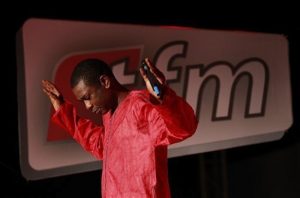 In this Wednesday, Sept. 1, 2010 photo, Senegalese pop star Youssou Ndour performs at the launch of his television station, TFM, in Dakar, Senegal. Outside of Senegal, the 50-year-old chart-topping artist is best-known for his grooving mbalax beat. In his native country, he is also known for his scathing critique of the ruling party. Senegal's government has forbidden Ndour from doing newscasts on his new channel, and the license allowing him to do 'cultural programming' was only granted after a two-year stalemate. (AP Photo/Rebecca Blackwell)